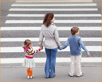 Mom crossing street with kids